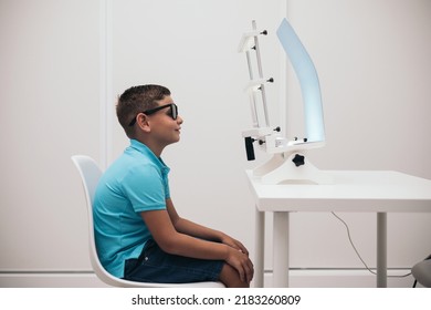 A child undergoes a convergence-divergence test using vectograms with polarized lenses.vision therapy.
