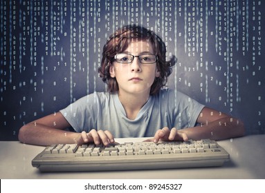 Child using a computer with binary code on the screen