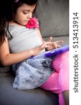 Child using digital tablet