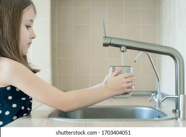 Child Using Filter To Purify Drinking Clean Water. Kitchen Faucet. Filling Cup Beverage. Infection Viruses Through Tap Water. Quality Check. World Water Monitoring Day. Environmental Pollution Concept