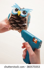 Child Using A Glue Gun In A Craft