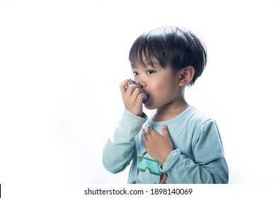 Child Using Inhaler On White Background.