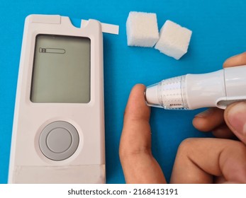 Child Using Lancet On Table And Control Of Sugar. Diabetes Test