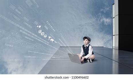 Child using laptop and digital information concept.