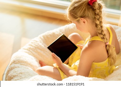 Child Using Tablet At Home