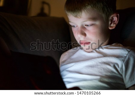 Child using technology device online