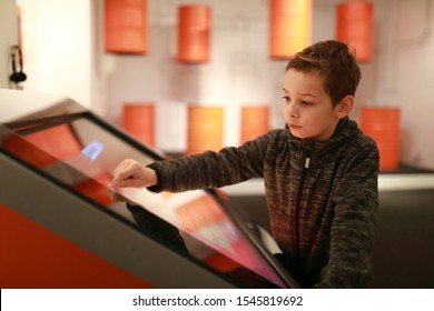 Child Is Using Touch Screen At Workshop