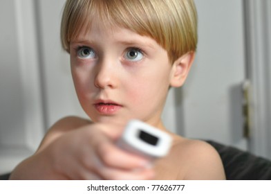 child using video game remote