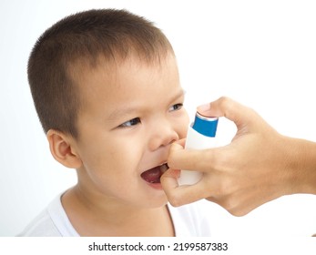 Child Using The Volumtic For Breathing Treatment, Kid Having Asthma Allergy Using The Asthma Inhaler, Healthcare Concept. Closeup Photo, Blurred