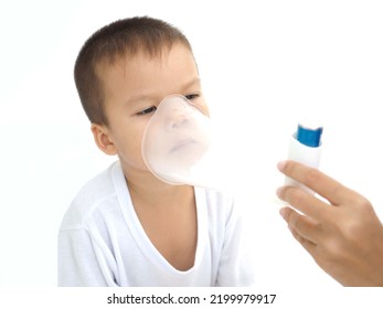 Child Using The Volumtic For Breathing Treatment, Kid Having Asthma Allergy Using The Asthma Inhaler, Healthcare Concept. Closeup Photo, Blurred.