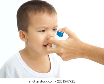 Child Using The Volumtic For Breathing Treatment, Kid Having Asthma Allergy Using The Asthma Inhaler, Healthcare Concept. Closeup Photo, Blurred.