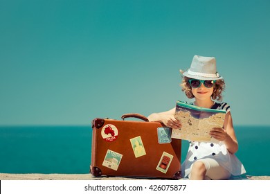 Child With Vintage Suitcase And City Map On Summer Vacation. Travel And Adventure Concept