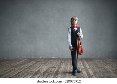 Child With Violin In Studio