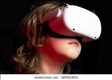 Child With VR Head Set. A New Generation Gaming Device For Entertainment And Sport.