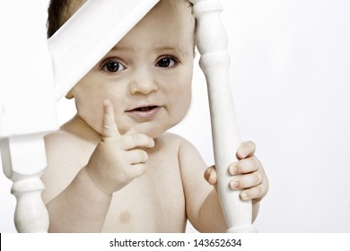 Child Wagging His Finger From The Stairs