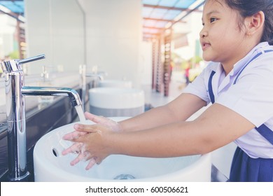 Child Wash Hands In Tub. School Children Hand Cleaner