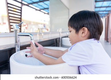 Child Wash Hands In Tub. School Children Hand Cleaner