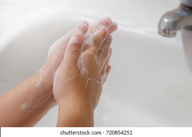 Child Washing Hand With Soap