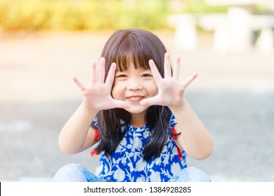 Child Washing Hands And Showing Dirty Hands At Playground.Hand Foot And Mouth Disease In Child Concept.