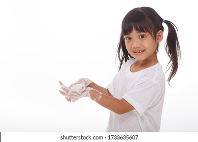 Child Washing Hands And Showing Soapy Palms.on White Background