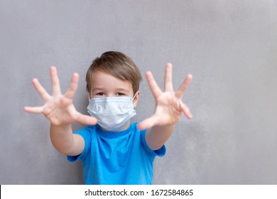 Child Wearing Face Mask During Corona Virus And Flu Outbreak. Disease And Illness Protection For Kids. Surgical Masks For Coronavirus Prevention. School Kid Coughing. Little Boy Going To School.