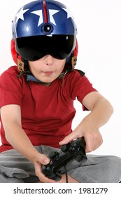 Child Wearing Helicopter Pilot Helmet With Sunvisor And Ear Muffs, Playing A Flight Simulator Game.