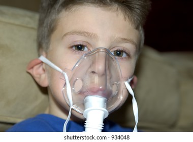 Child Wearing A Oxygen Mask