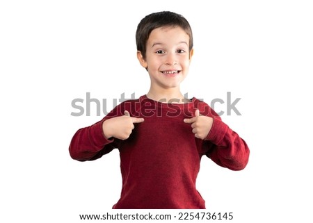 Child wearing red t-shirt over white isolated background looking confident with smile on face, pointing oneself with fingers proud and happy.