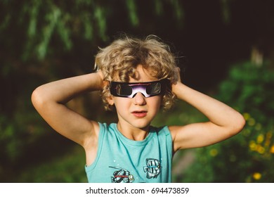 Child Wearing Solar Eclipse Glasses