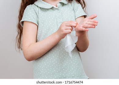 The Child Wipes Her Hands Wet Antibacterial Wipe. Stop Virus.