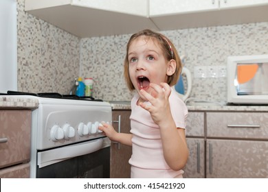 child without supervision of parents playing with  stove