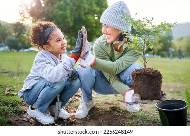 Child, woman and high five for plant gardening at park with trees in nature environment, agriculture or garden. Happy volunteer family celebrate planting for ecology and sustainability on Earth day - Powered by Shutterstock