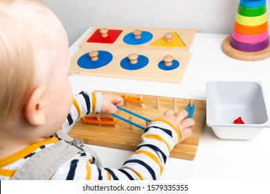 Child Works With Montessori Material For Fine Motor Skills, Sensory Play. Playing Children