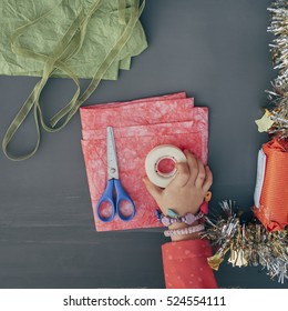 Child Wrapping A Gift