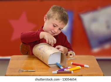 Child Wrapping A Homemade Gift