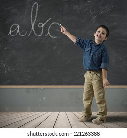 Child Writing Abc In A Blackboard