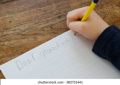 Child Writing A Letter To Grandma