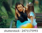 
Child Yelling While Mom Tries to Speak on the Phone
Little kid interrupting her mother while trying to have a conversation
