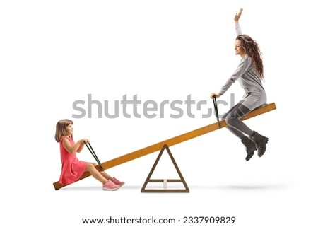 Child and a young woman playing on a seesaw isolated on white background