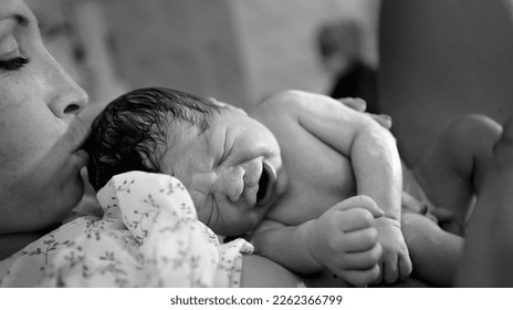 childbirth. Mother and newborn. The birth of a child in a maternity hospital. A young mother hugs her newborn baby after giving birth. Childbirth woman. The first moments of a child's life after child - Shutterstock ID 2262366799