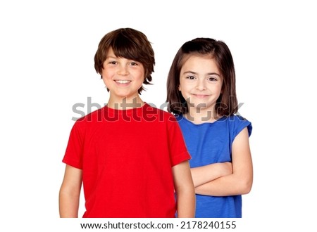 Childhood, fashion and people concept - happy smiling boy and girl looking at camera isolated on a white background