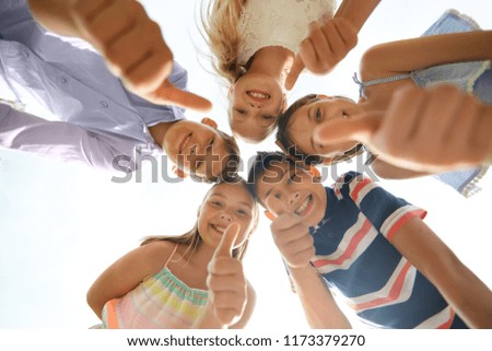 Similar – Little happy smiling kids playing in a tall grass