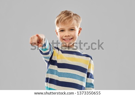 Similar – Foto Bild Ein Junge zeigt mit dem Finger auf einem Bahn ( Waggon ) Wagen auf ein Hinweis Schild. “ der Aufenthalt auf der Bühne ist verboten“ !!