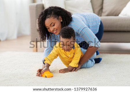 Similar – Image, Stock Photo Mother and toddler with mobile phone in hand