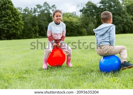 Similar – Little happy smiling kids playing in a tall grass