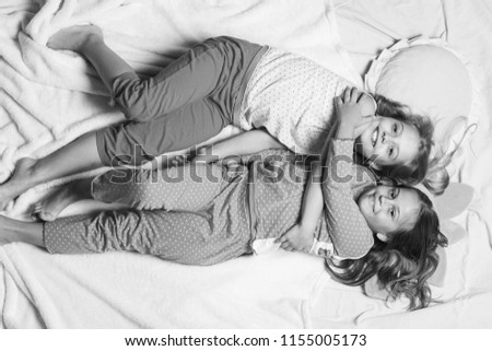 Similar – Joyful couple laughing together on a vintage sofa