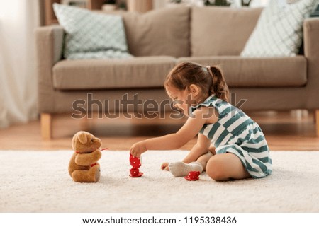 Similar – Image, Stock Photo Little girl playing in a home playground