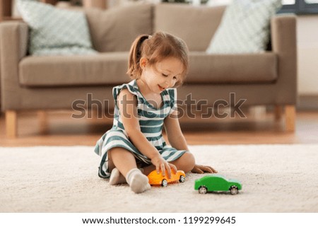 Similar – Image, Stock Photo Little girl playing in a home playground