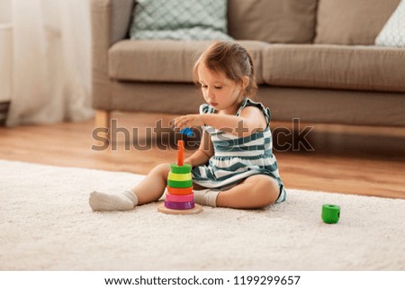 Similar – Image, Stock Photo Little girl playing in a home playground