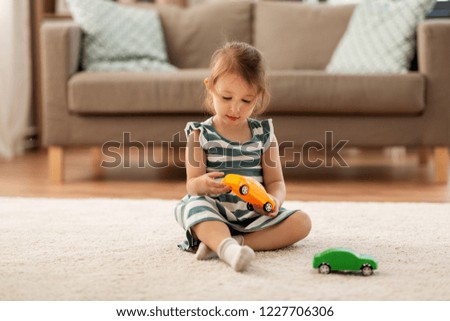 Similar – Image, Stock Photo Little girl playing in a home playground